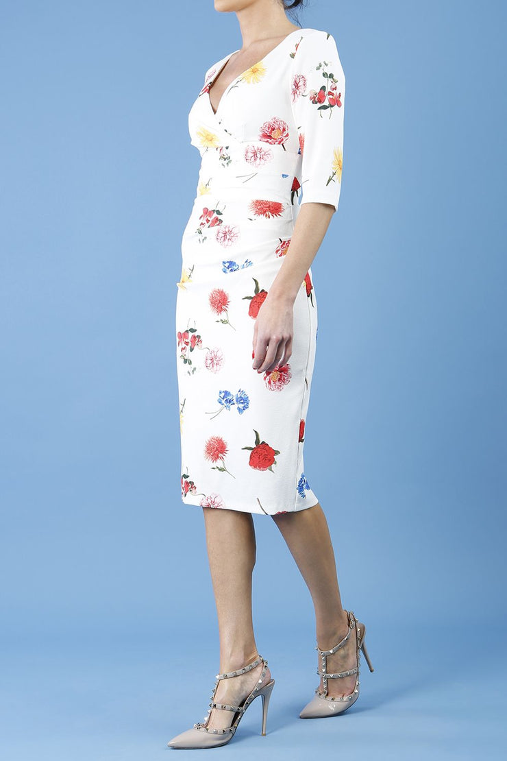 Model wearing the Diva Cynthia Floral Print dress with pleating across the front in buttercup print front