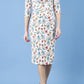 Model wearing the Diva Cynthia Floral Print dress with pleating across the front in linear tulip print front