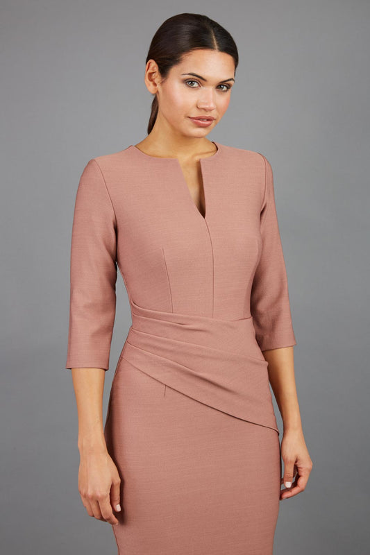 brunette model wearing seed diva catwalk milton sleeved pencil dress with a rounded neckline with a split in the middle in acorn brown front