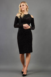 blonde model is wearing diva catwalk partyon glitter pencil dress with cold shoulder in black front
