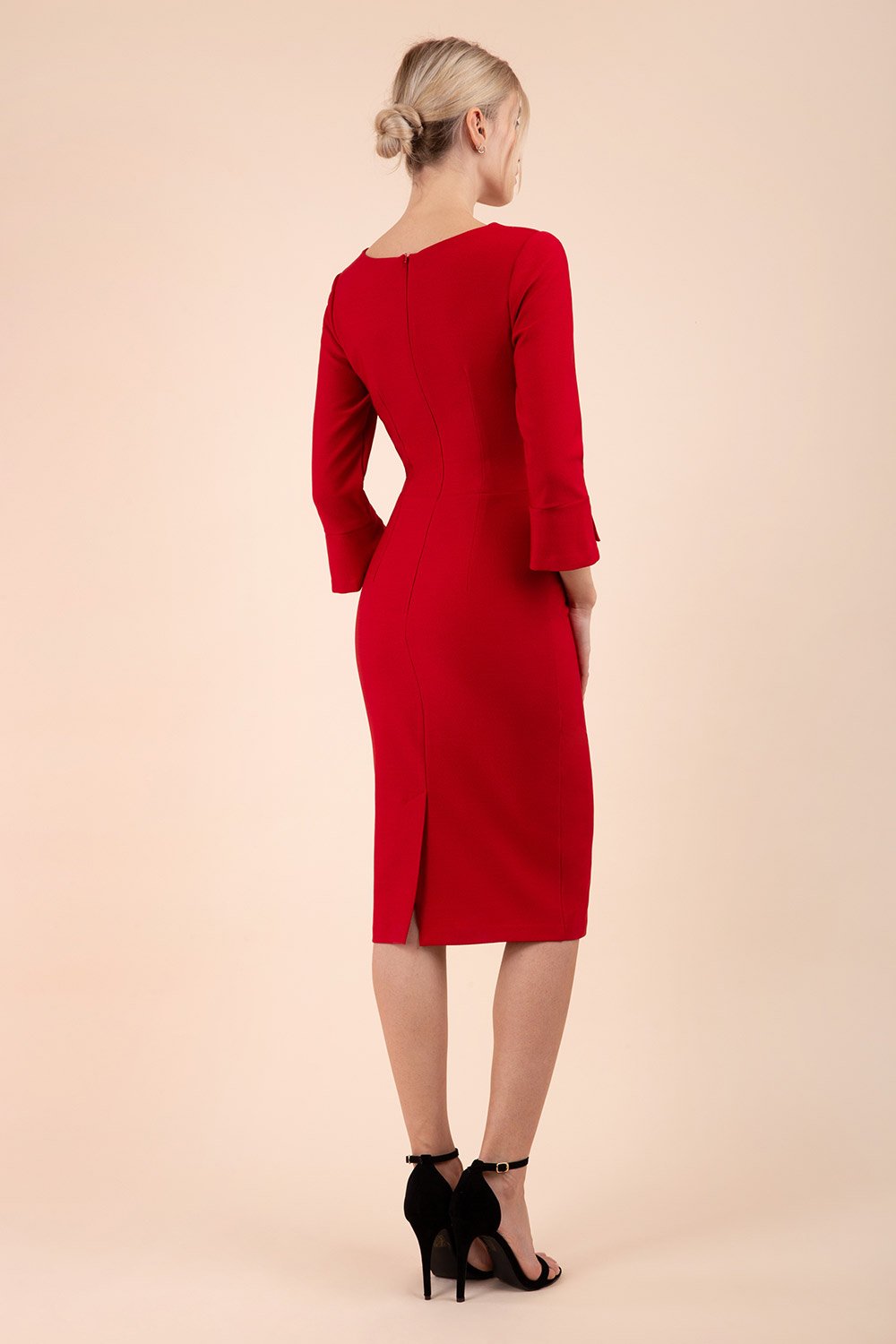 Model wearing diva catwalk Seed Orla Asymmetric Pencil Dress in Cardinal Red back