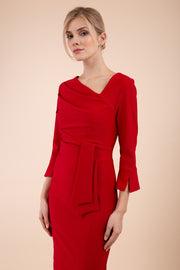 Model wearing diva catwalk Seed Orla Asymmetric Pencil Dress in Cardinal Red front