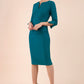 blonde model wearing seed tuscany pencil fitted dress in pacific green colour with a split in the neckline and split detail on sleeves front