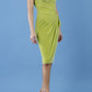 brunette model is wearing diva catwalk velvet pencil dress with V-neck and wrap skirt in tropical green front