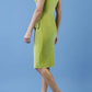brunette model is wearing diva catwalk velvet pencil dress with V-neck and wrap skirt in tropical green back