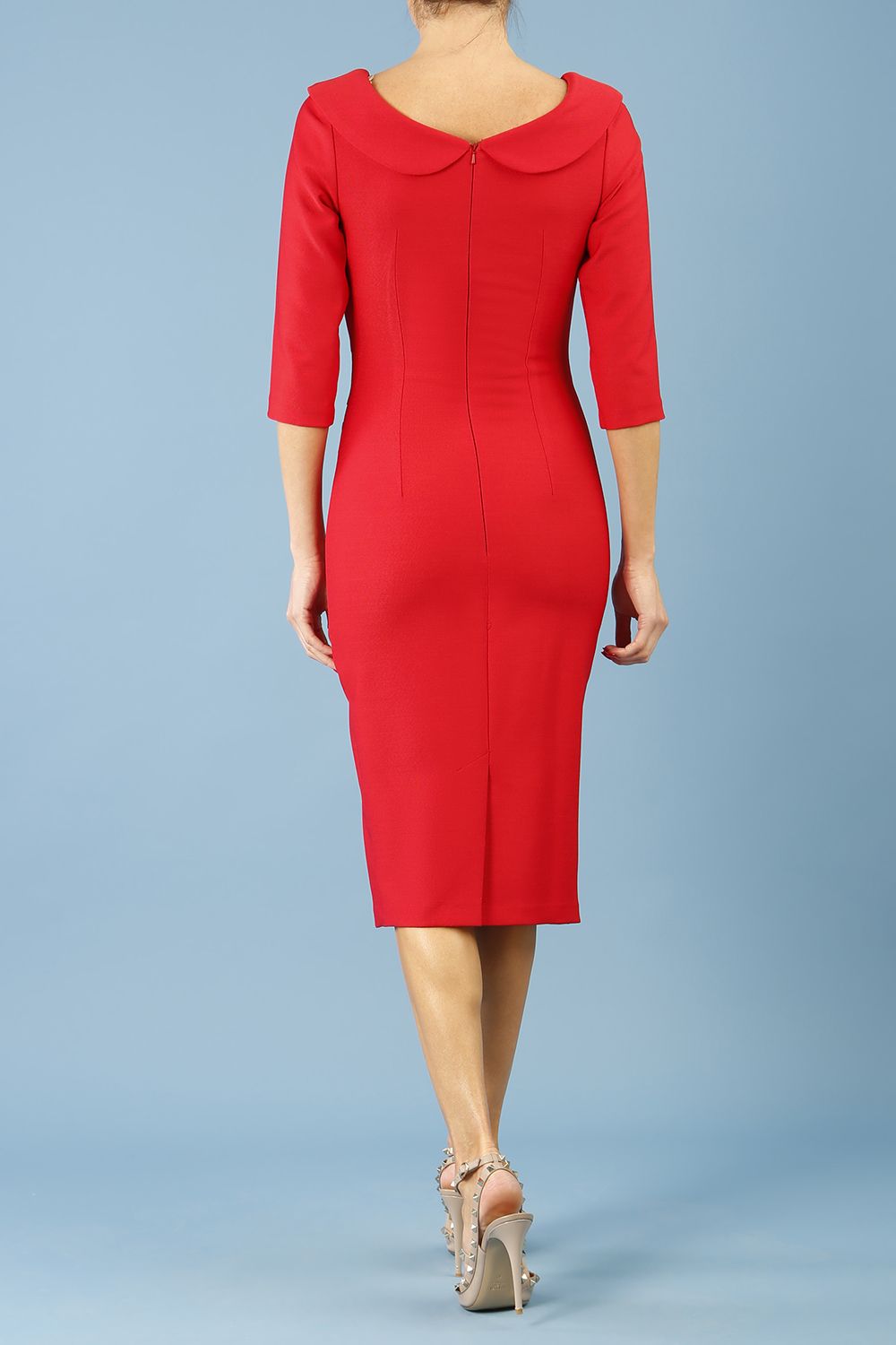 model is wearing diva catwalk seed axford pencil sleeved dress with rounded folded collar in salsa red back
