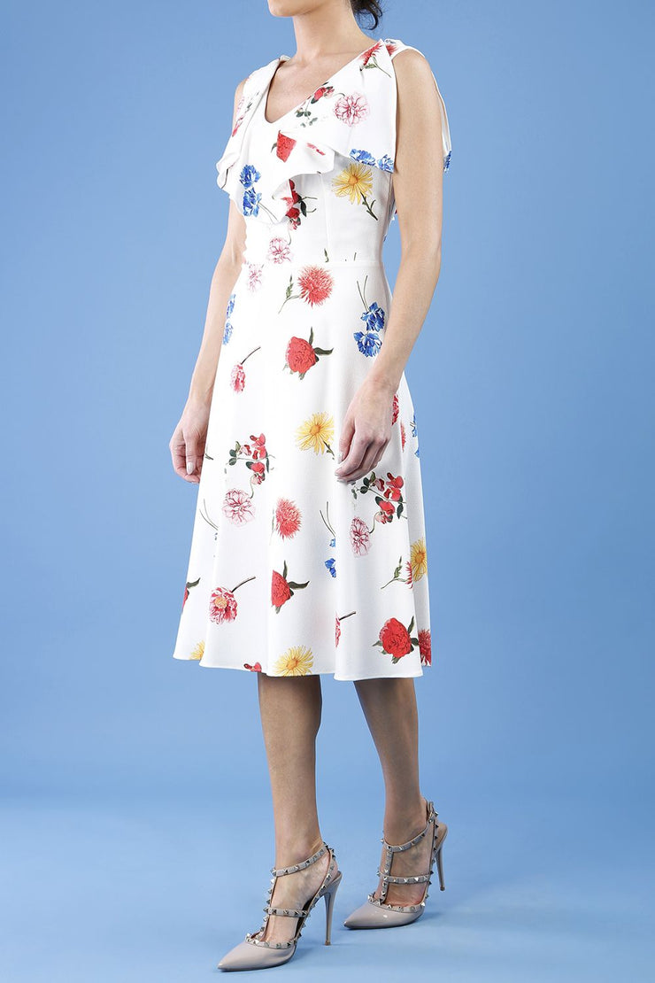 model is wearing diva catwalk layla a-line swing printed dress without sleeves in buttercup print front