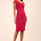 brunette model wearing diva catwalk evening pencil skirt dress sleeveless with lowered neckline and pleating on side in dazzle pink colour front