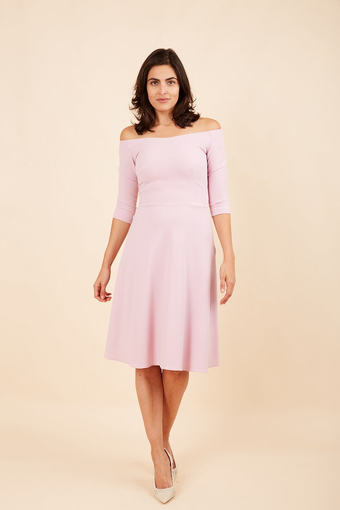 brunette model is wearing diva catwalk off shulder swing a-line islay dress with sleeves in dawn pink front