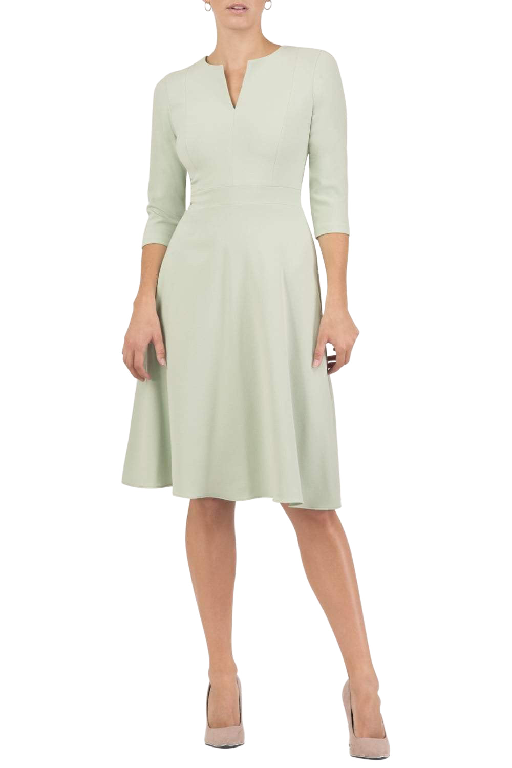 blonde model wearing diva catwalk romney three quarter sleeve swing dress with a band in deco green front