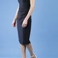 model wearing diva catwalk little black dresses with low v-nwcklinw and pencil skirt sleeveless style side