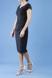 model wearing diva catwalk little black dresses with low v-nwcklinw and pencil skirt sleeveless style side