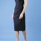 model wearing diva catwalk little black dresses with low v-nwcklinw and pencil skirt sleeveless style front