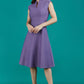 Brunette Model is wearing a sleeveless swing high neck dress with high neck in dusky lilac by Diva Catwalk front