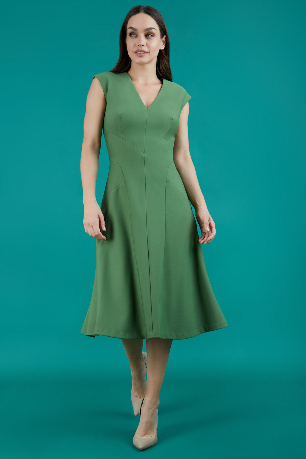 model wearing diva catwalk rochelle swing skirt a line dress without sleeves with a low v neck in vineyard green front