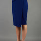 model is wearing diva catwalk antibe pencil asymmetric skirt with pleating at the front in oxford blue front
