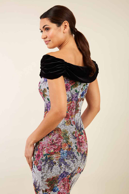 model wearing diva catwalk verdana matilda jaquard pencil-skirt fitted dress print and black velvet bardot neckline sleeveless and knee length 