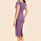 brunette model wearing diva catwalk juilet midaxi pencil sleeveless off shoulder dress with open neck and folded collar in colour mauve purple back