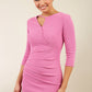 model wearing diva catwalk helston begonia pink pencil skirt dress with sleeves and cut out detail on the neckline front