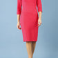 brunette model is wearing diva catwalk seed rosa plain dress with rounded neckline in opera pink front