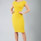 Model wearing Diva Catwalk Polly Rounded Neckline Pencil Cap Sleeve Dress with pleating across the tummy area in mustard yellow front