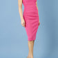 model is wearing diva catwalk polly cap sleeve pencil dress with rounded neckline at the front and deep lowered rounded cutout at the back in fuchsia pink front
