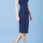 model is wearing diva catwalk polly cap sleeve pencil dress with rounded neckline at the front and deep lowered rounded cutout at the back in navy blue front