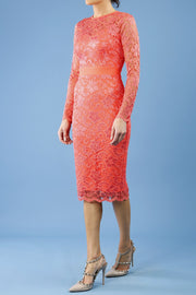 Model wearing the Diva Cherrie Lace Pencil dress with long sleeves and round neck in hot coral front