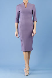 model is wearing diva catwalk seed amalfi plain pencil dress with high v-neck and sleeves in dusky lilac front
