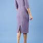 model is wearing diva catwalk seed amalfi plain pencil dress with high v-neck and sleeves in dusky lilac back
