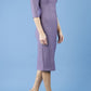 model is wearing diva catwalk seed amalfi plain pencil dress with high v-neck and sleeves in dusky lilac side