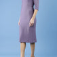 model is wearing diva catwalk seed amalfi plain pencil dress with high v-neck and sleeves in dusky lilac front