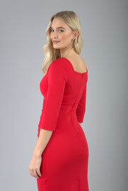 model is wearing diva catwalk hathaway sweetheart neckline pencil dress in electric red back