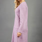 blonde model wearing diva catwalk irena cosy sleeved knee length dress with pockets and v-neckline in soft fabric pink front