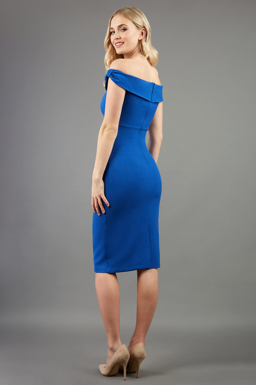 model wearing diva catwalk cloud pencil fitted flattering dress off shoulder sleeveless with detail with pleating around the front in cobalt back