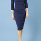 model is wearing diva catwalk polly sleeved pencil dress with low rounded neckline at the back in navy blue front