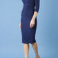 model is wearing diva catwalk polly sleeved pencil dress with low rounded neckline at the back in navy blue side