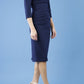 model is wearing diva catwalk quatro sleeved pencil dress with asymmetric wide cut our neckline in navy blue front