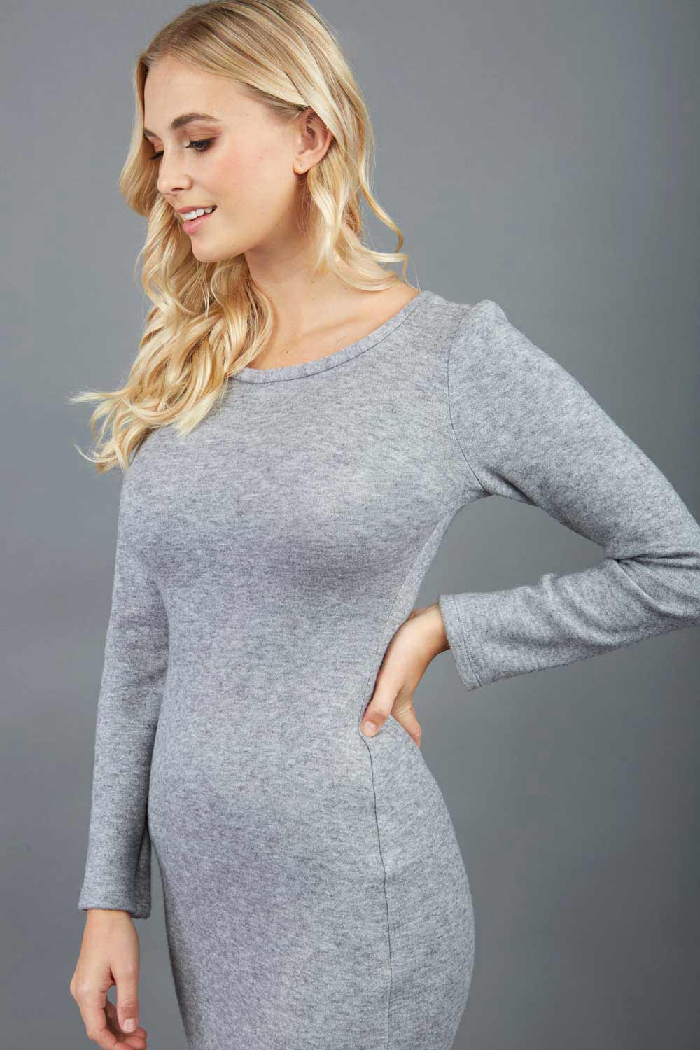 blonde model wearing diva catwalk elstar pencil plain dress made of very soft and cosy cashmere fabric with long sleeves in grey front