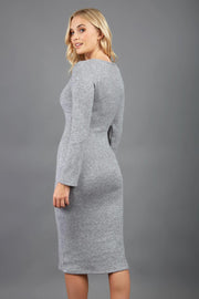 blonde model wearing diva catwalk elstar pencil plain dress made of very soft and cosy cashmere fabric with long sleeves in grey back
