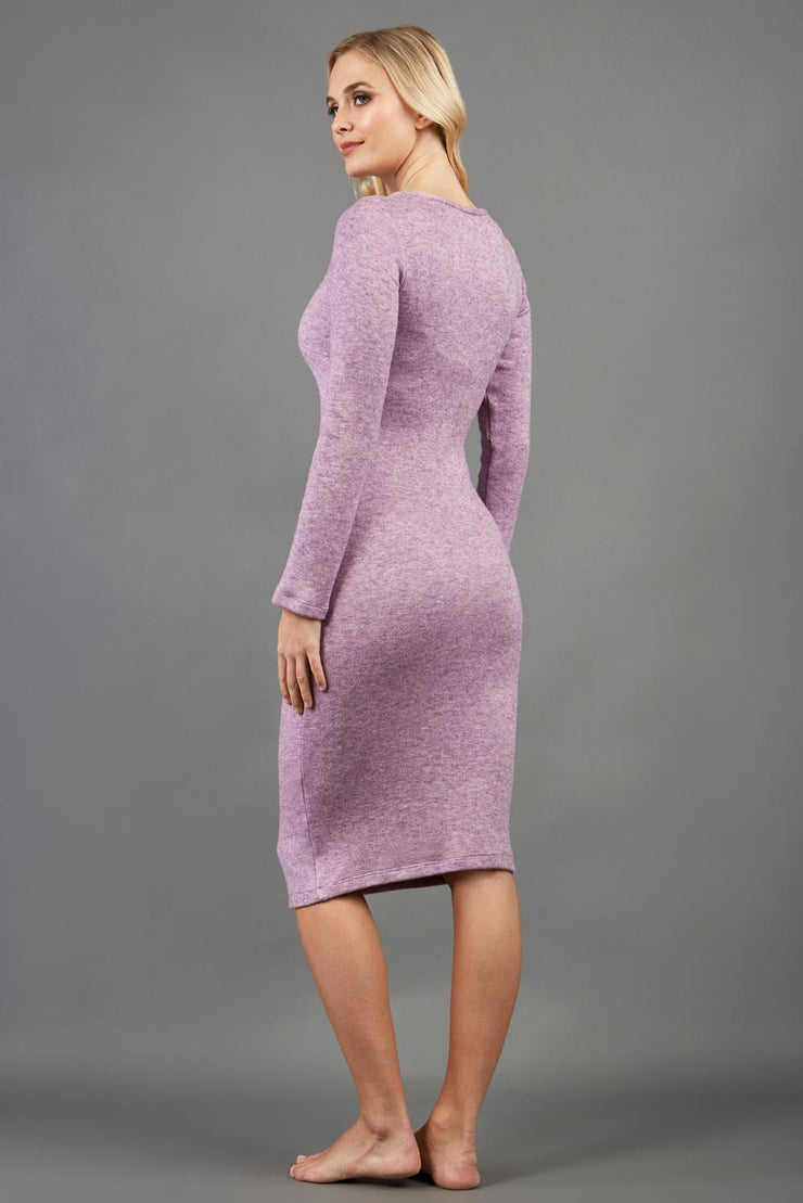 blonde model wearing diva catwalk elstar pencil plain dress made of very soft and cosy cashmere fabric with long sleeves in pink back
