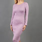blonde model wearing diva catwalk elstar pencil plain dress made of very soft and cosy cashmere fabric with long sleeves in pink front