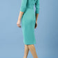 model is wearing diva catwalk eliza sleeved pencil dress with collared v-neck in emerald Green back