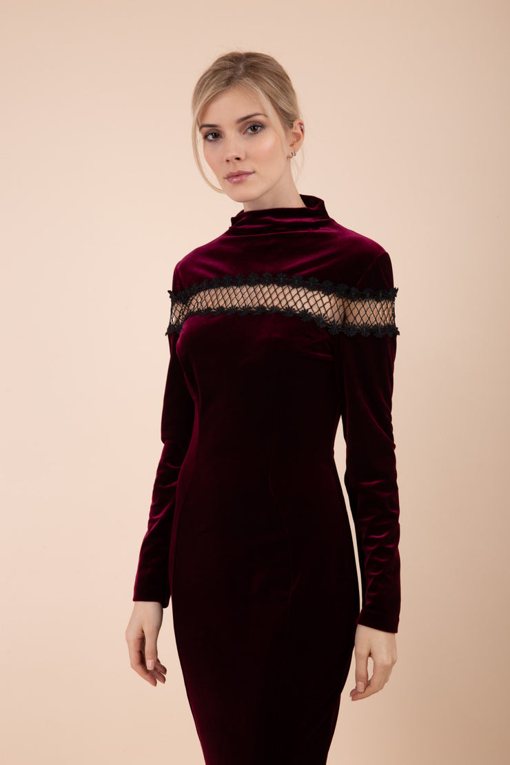 blonde model wearing diva catwalk burgundy pencil dress called trocadero pencil midaxi style with funnel neckline and lace detail and long sleeves front