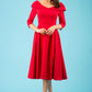 Model wearing Diva Catwalk Chesterton Sleeved dress with oversized collar detail and a-line swing pleated skirt in colour red front