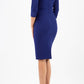 model wearing diva pencil dress tulip design with overlapping pencil skirt with 3 4 sleeves in colour oxford blue back