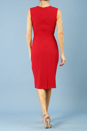 Model wearing Diva Clara Pencil dress with vertical pleat detailing at bust sleeveless design in scarlet red back