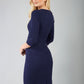 model is wearing diva catwalk ubrique pencil dress with sleeve and keyhole detail on a front panel in navy blue back