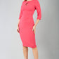 brunette model wearing diva catwalk ubrique pencil dress with a keyhole detail and sleeves in fuchsia pink front