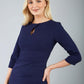 model is wearing diva catwalk ubrique pencil dress with sleeve and keyhole detail on a front panel in navy blue front
